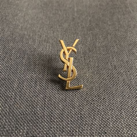 vintage ysl pins.